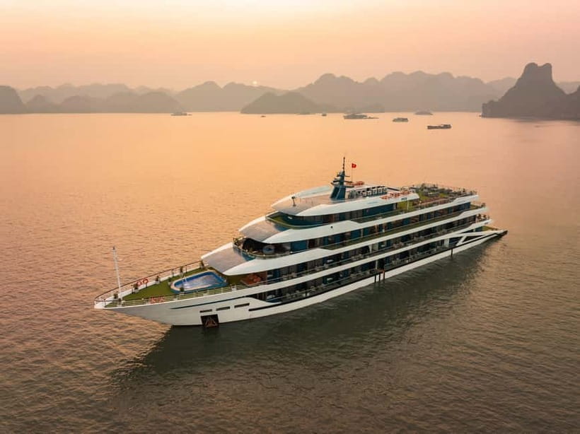 2-Day or 3-Day: Halong&Lan Ha Bay Cruise 5<em> balcony,bathtub – Key points before you book’ /></p>
<ul>
<li><strong>A balcony and bathtub make the cabin the strongest feature</strong>, giving you a private place to watch the karst islands slide past.</li>
<li><strong>The three-day option adds Viet Hai Village</strong>, with a bicycle or electric-car ride and a look at local village life.</li>
<li><strong>Tra Bau offers kayaking and swimming</strong>, but the swimming setup can be less appealing if the boat remains nearby.</li>
<li><strong>Dark and Bright Cave is a calmer, more scenic outing</strong>, by kayak or bamboo boat rowed by local boatmen.</li>
<li><strong>The crew is a major plus</strong>, with William and Ashley singled out for being friendly and attentive.</li>
<li><strong>Food is the weak point for some people</strong>, so special diets and allergies should be reported before departure.</li>
</ul>
<h2 id="what-the-doria-cruise-does-well">What the Doria Cruise does well</h2>
<p><img width="487" height="650" decoding="async" src=