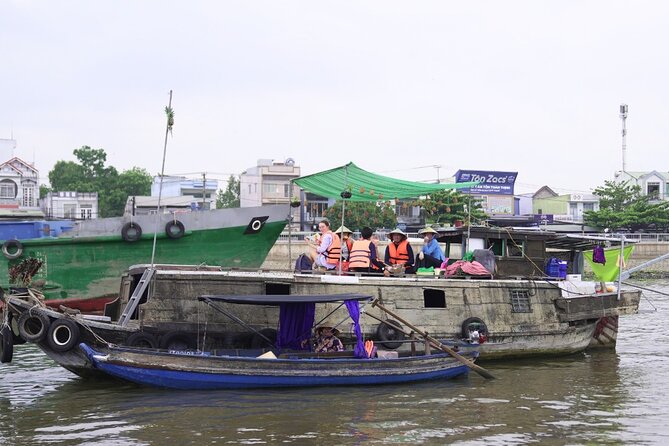 Can Tho Floating Market and Fruit Garden Tour - From market traffic to the small canal