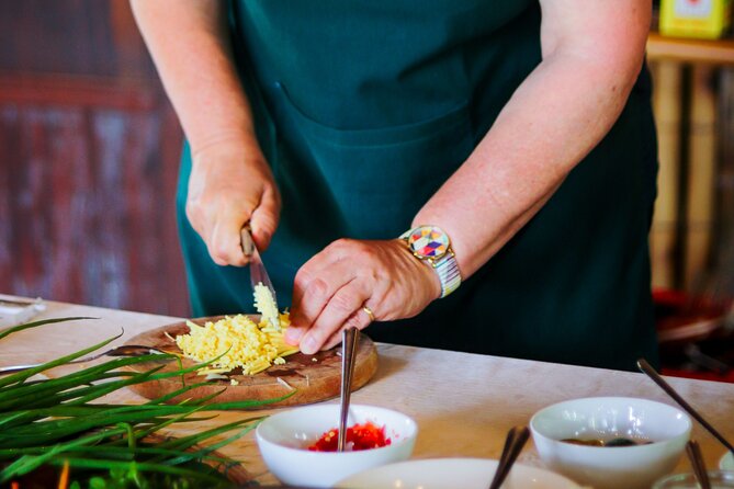 Cocolocal Farm Cooking Class with market tour and basket boat - Cooking Banh Xeo, Pho, Papaya Salad, and Spring Rolls