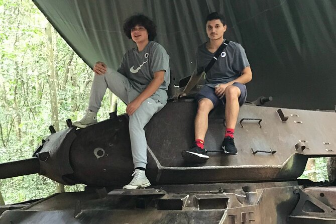 Cu Chi Tunnels tour In The Morning by DGT - Entering the tiny tunnel openings