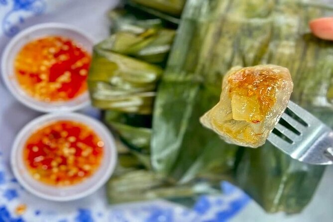 DaNang Night Foodie Tour-Sighseeing with Aodai Lady Rider Private - Dragon Bridge and the Han River after dark