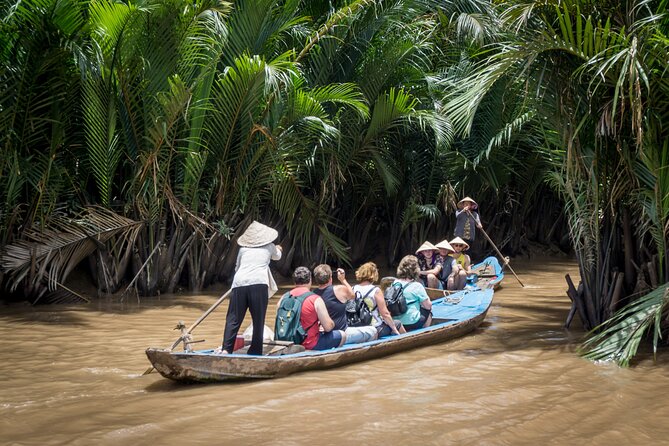Essential Mekong Delta: Highlights Tour from Ho Chi Minh City - Orchard paths, fruit, and Southern folk music