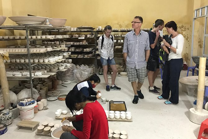 Explore Bat trang village & Ceramics factories with local guide - Walking through working ceramic factories