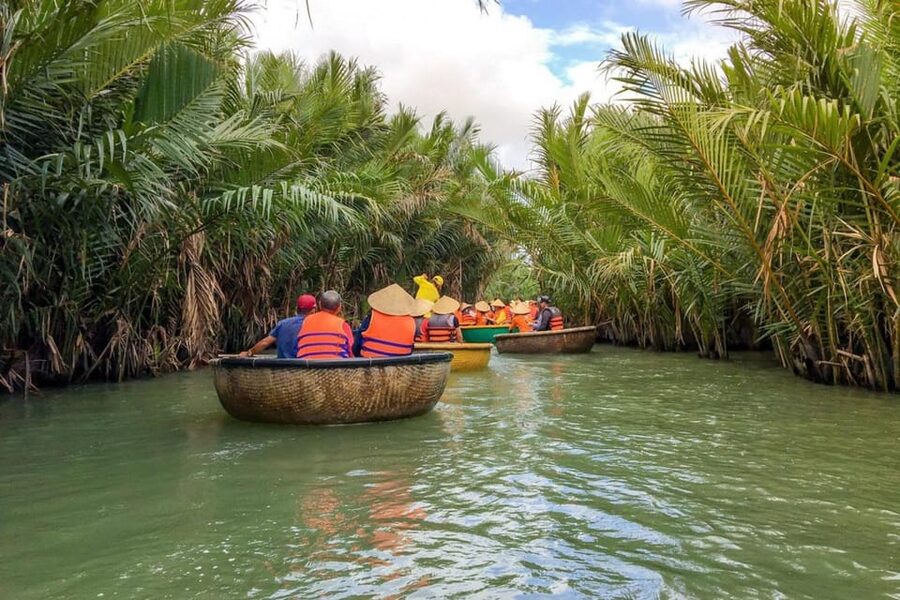 From Hoi An: Bay Mau Coconut Forest Bamboo Basket Boat Ride - Entering the water coconut forest