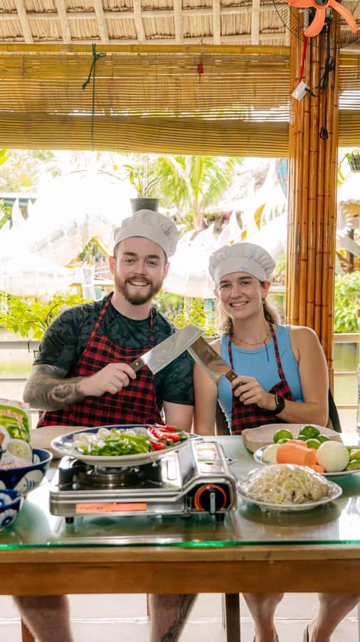 From Hoi An: Market Tour, Basket Boat Ride and Cooking Class - A bamboo basket boat through the coconut palms