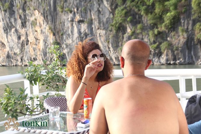 Ha Long Bay Cruise Day Tour with lunch, kayaking, surprise cave & titop island - Swimming, sunset, and the return cruise