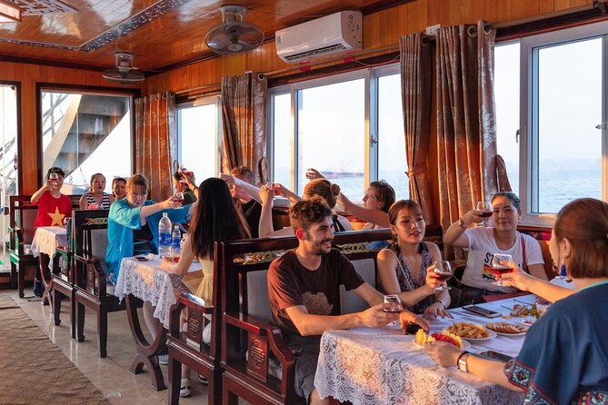 Halong Bay Day Tour With Titop Island, Cave, Kayak & Lunch - Kayaking or bamboo boat at Luon Cave