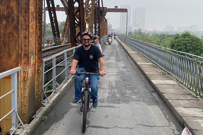 Hanoi City Bike Tour through Banana Island & Food Tasting - Railway tracks and the city’s narrow spaces