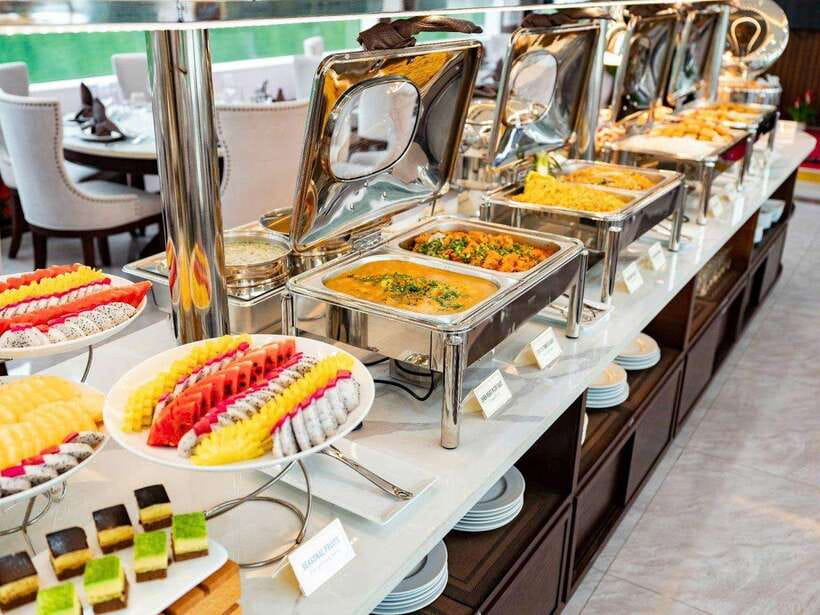 Hanoi: Ha Long Bay Day Trip - Luxury Cruise & Buffet Lunch - Buffet lunch with limestone islands outside the window