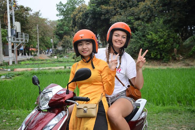 Hanoi Motorbike Food Tours: Hanoi Motorbike Tours Led By Women - Long Bien Bridge and the Red River setting
