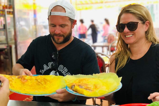 Ho Chi Minh City Street Food Tour & Sightseeing By Motorbike - Snacking at the Cambodian Market