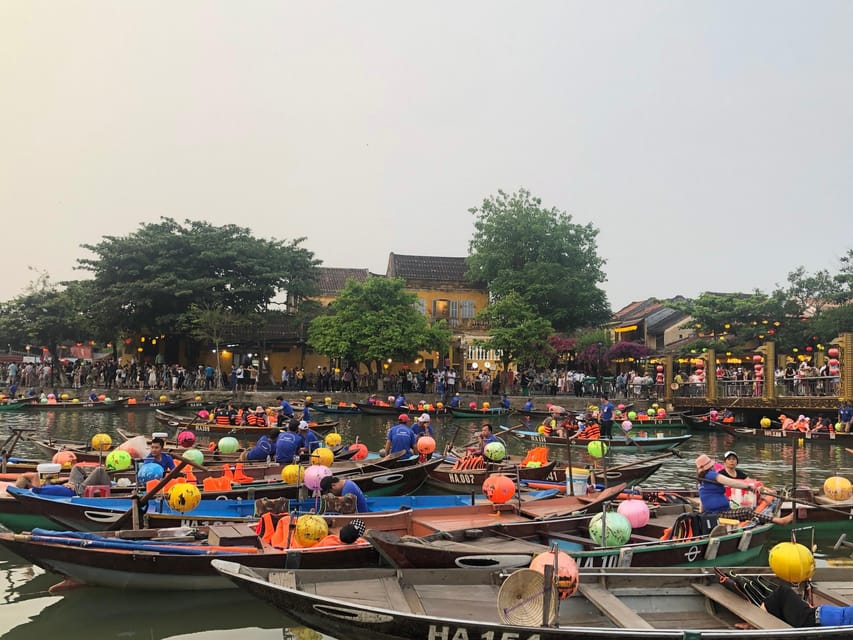 Hoi An Lantern Boat Ride on the Thu Bon River - Lighting the flower lantern and making a wish