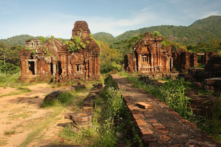 Hoi An: My Son Sanctuary and Thu Bon River Boat Trip - Walking through My Son’s tower-temples