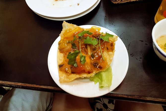 Hoi An Street Food Walking Tour with Tastings - Walking through Hoi An after the heat eases