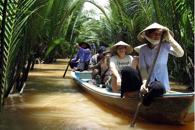 Mekong Delta Tour Full Day Cai Be-Vinh Long - Shaded canals in a traditional rowboat
