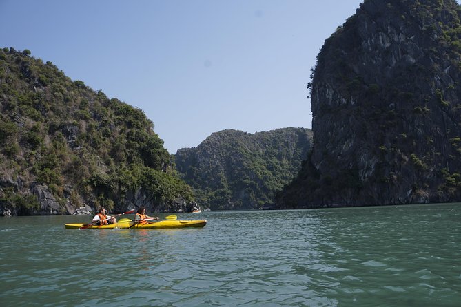 Most favorite full day boat tour with kayaking in Lan Ha bay, Ha Long bay - Kayaking through the Dark-Bright cave area