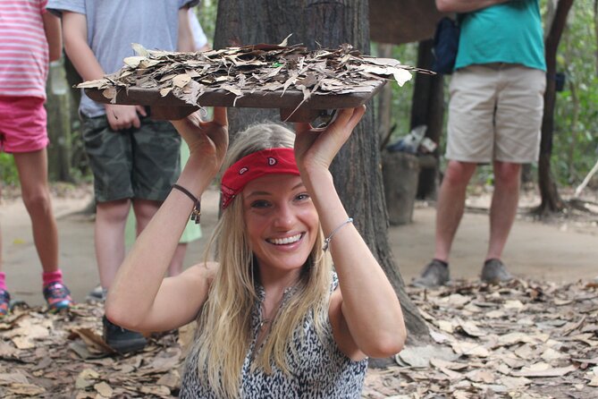 Premium Cu Chi Tunnels Tour with Local Expert by SpeedBoat - Crawling into the restored tunnel