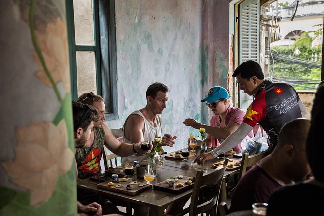 Private Hoi An Evening Food Tastings Tour by Bike - Evening food by the river