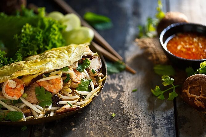 Private Jeep Tour Saigon by Night: Foodie & City Tour - Dinner at two restaurants, with some uncertainty