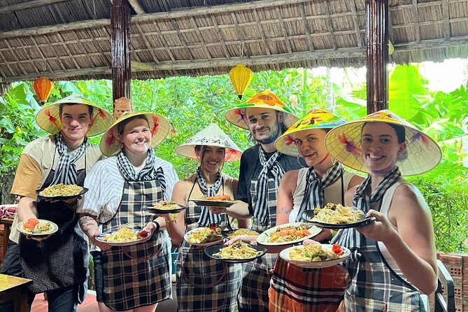 RICE PAPER Noodle Making Experience & Hoi An Cooking Class Class - Making rice paper noodles with a local villager