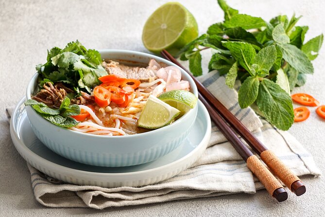Saigon By Night and Vietnam Local Food on Motorbike - Bun bo Hue brings central Vietnam to the table