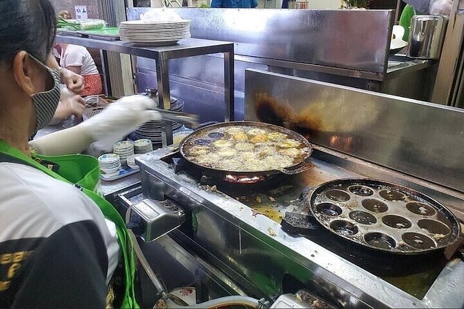 Saigon Evening Walking Street Food Tour - Bánh xèo and bánh khọt at a neighborhood restaurant