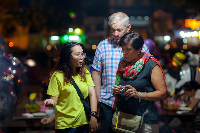 Saigon Night Street Food and City Tour on Scooter - Stop one: Vietnamese pancakes and the first ride