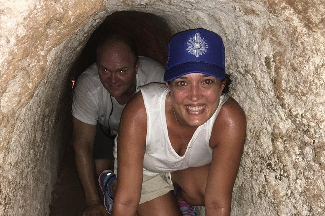 Small-Group Cu Chi Tunnels Half-Day Tour from Ho Chi Minh City - Walking through the forest and wartime displays