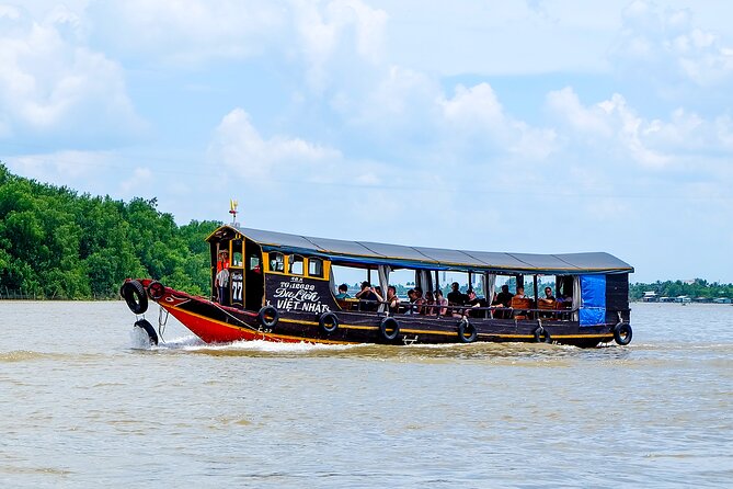 Small-Group Mekong Delta Day Trip: Boat Ride, Cottages & Pagoda - The hand-rowed boat through narrow canals