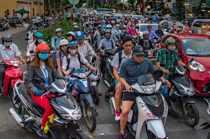 Small-group Street Food Lover by Motorbike (04 hours) - Getting into the city by motorbike