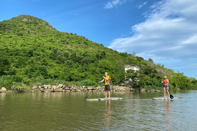 Stand Up Paddle Boarding and Sunset Watching on Cai River - Meeting guides Nguyen and Tu