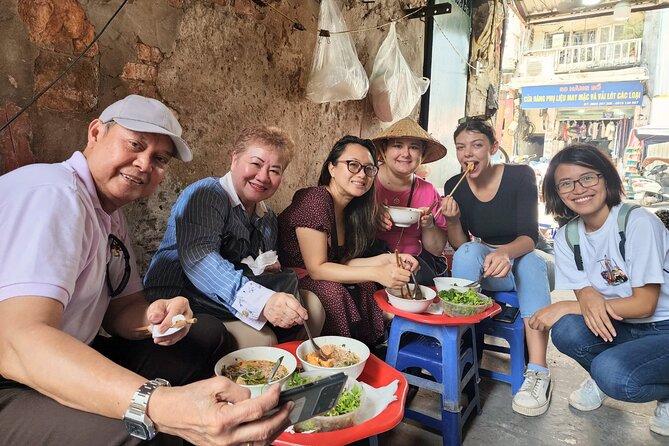 TASTE OF HANOI - walking street food adventure - A banh mi pause beside Hang Ma