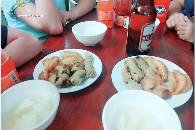 Tasting 8 Different Hanoi Street Foods at Noon Time - Walking through six to eight food vendors